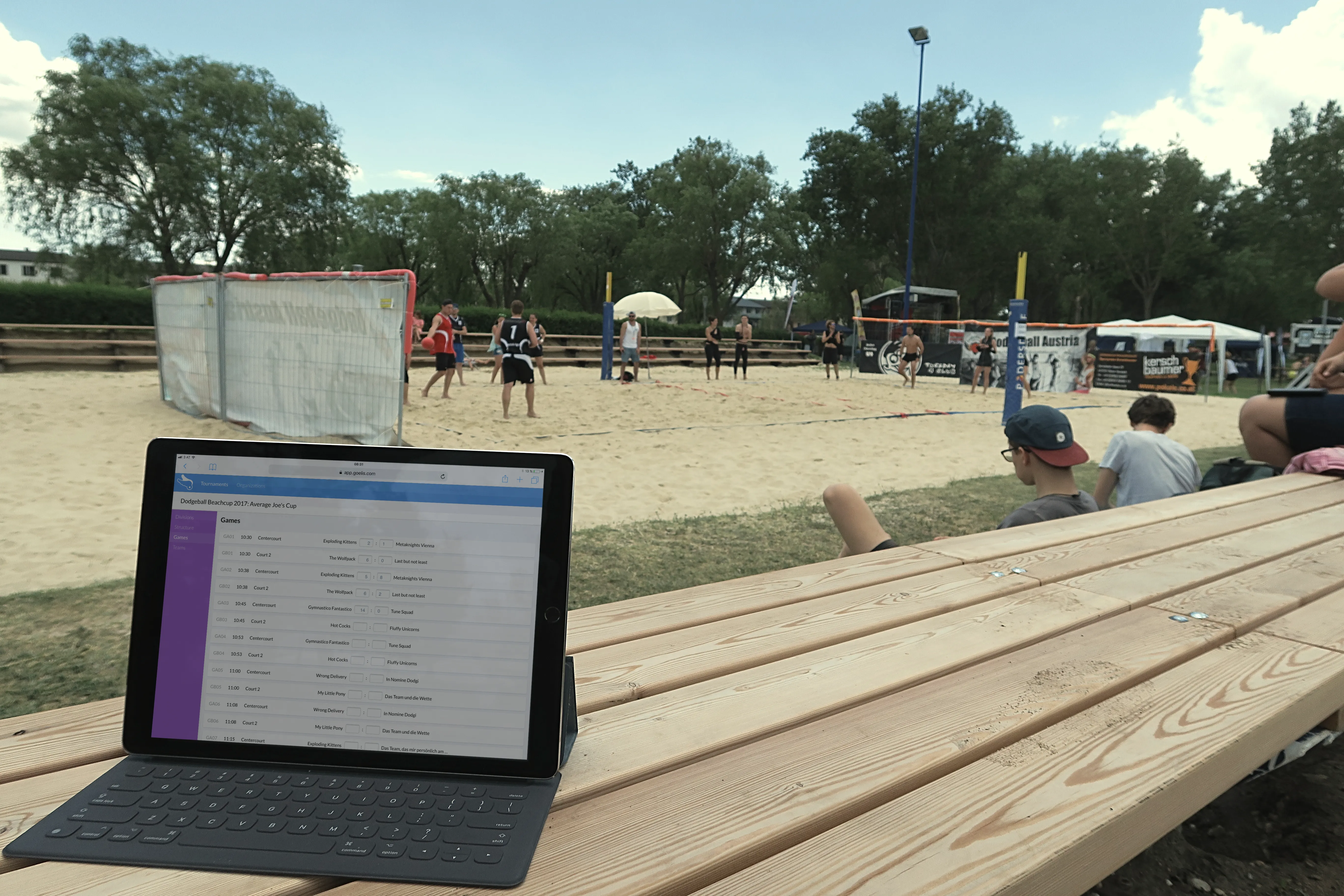 An organizer running a live tournament schedule on an iPad courtside